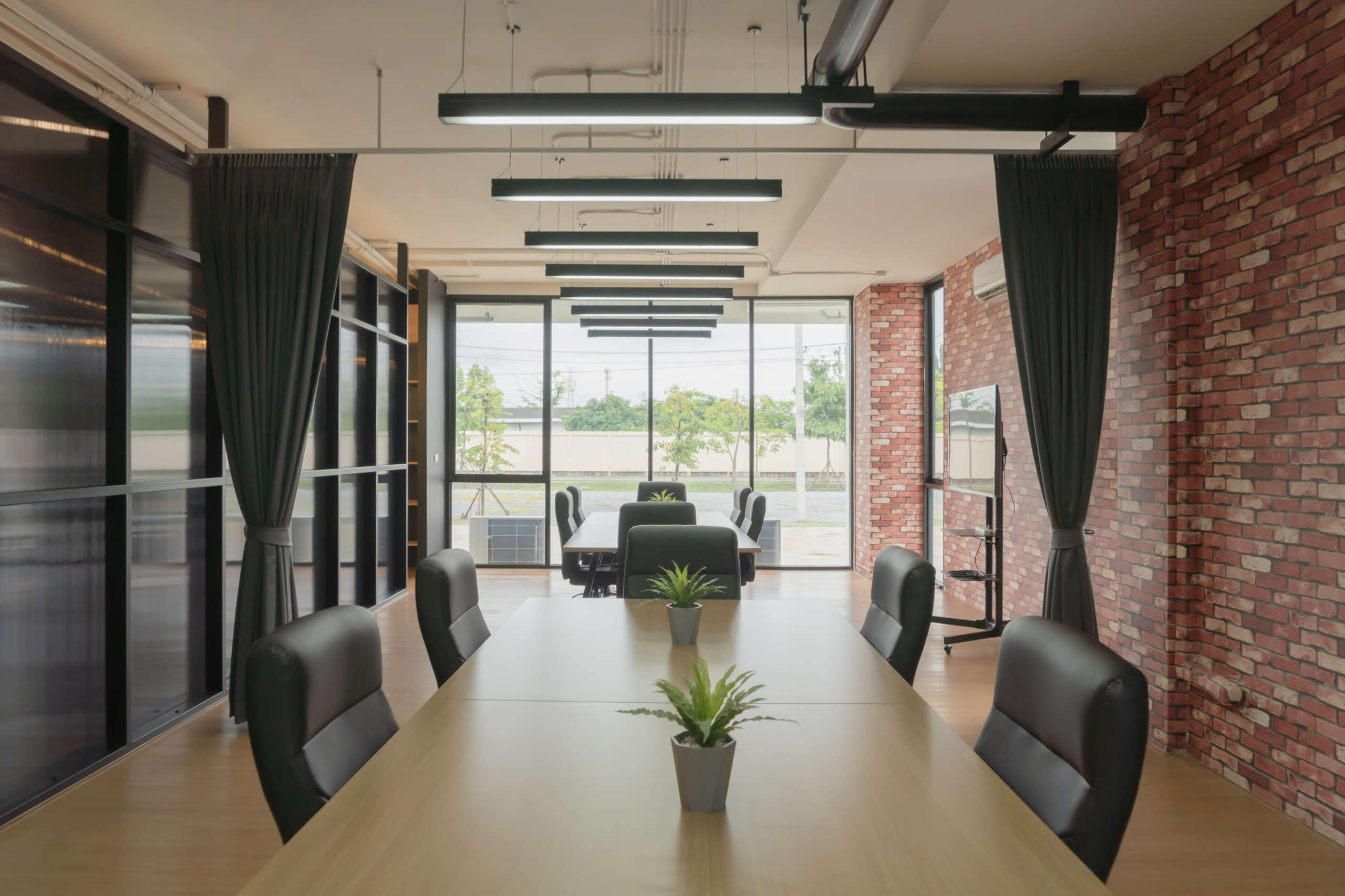 Modern community lounge service with TV monitor. Meeting room or co-working space area. Interior design decoration.